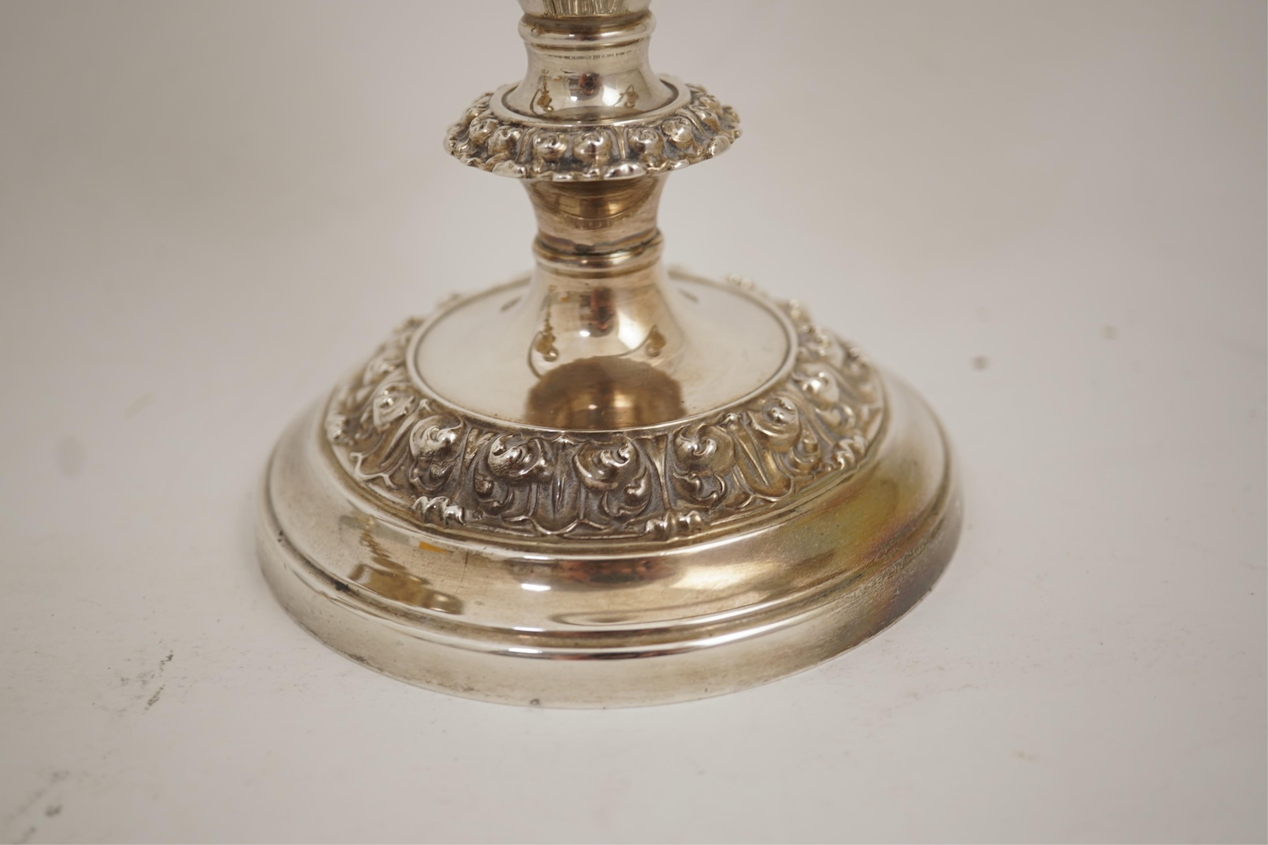 A pair of Elizabeth II silver dwarf two branch, three light candelabra by Barker Brothers Silver Co, with scroll arms and turned knopped stems, Birmingham, 1960, weighted, arms 52oz.